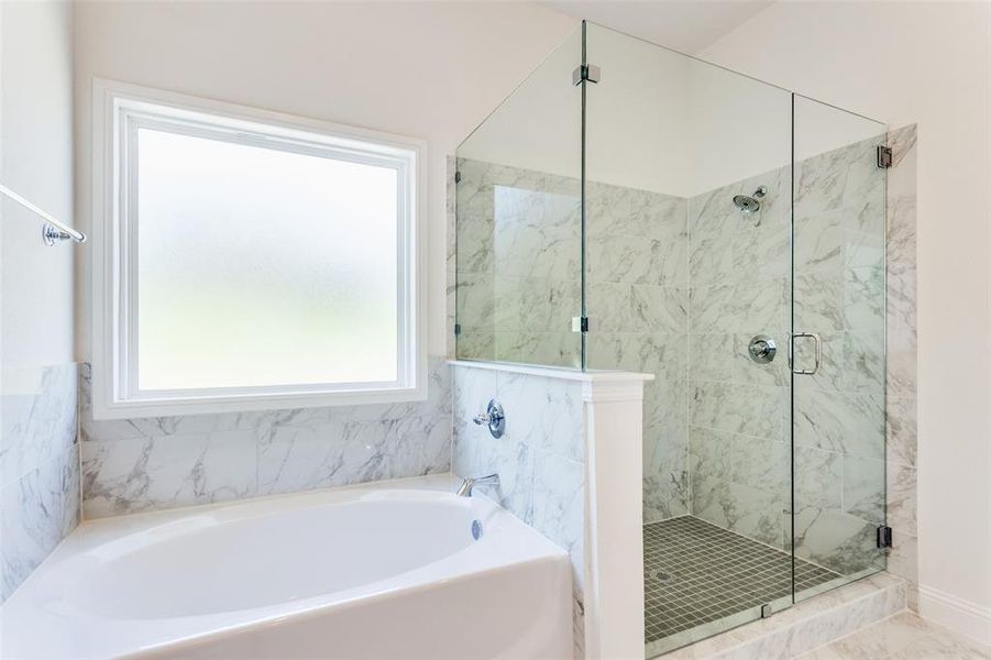 Bathroom with shower with separate bathtub and tile floors