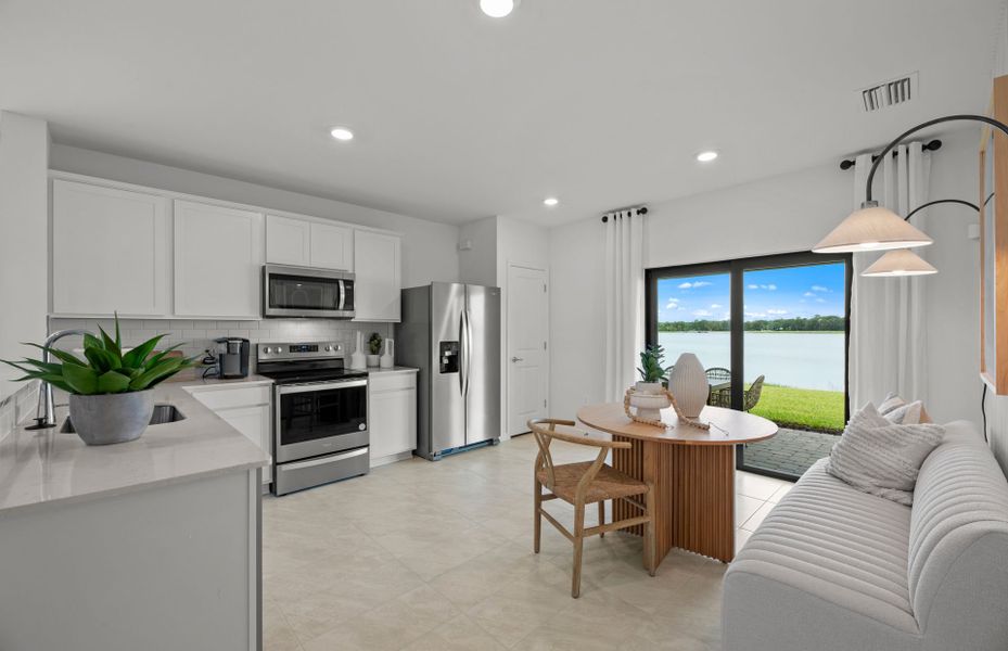 Naturally lit dining area that flows from the kitc