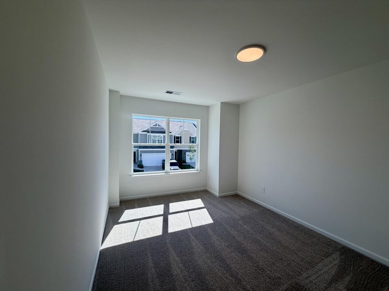Spacious, unfurnished interior of a new home in Bellevue Townhomes, Greenville (Image 10).