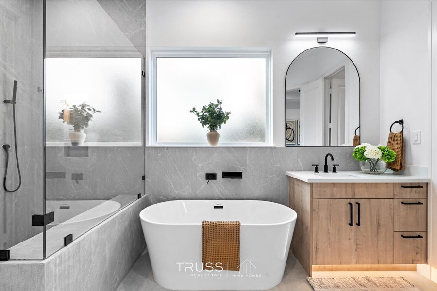 Bathed in daylight, the soaking tub’s placement evokes a moment of calm, an everyday luxury reimagined