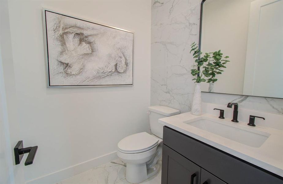 Raised powder room with accent wall