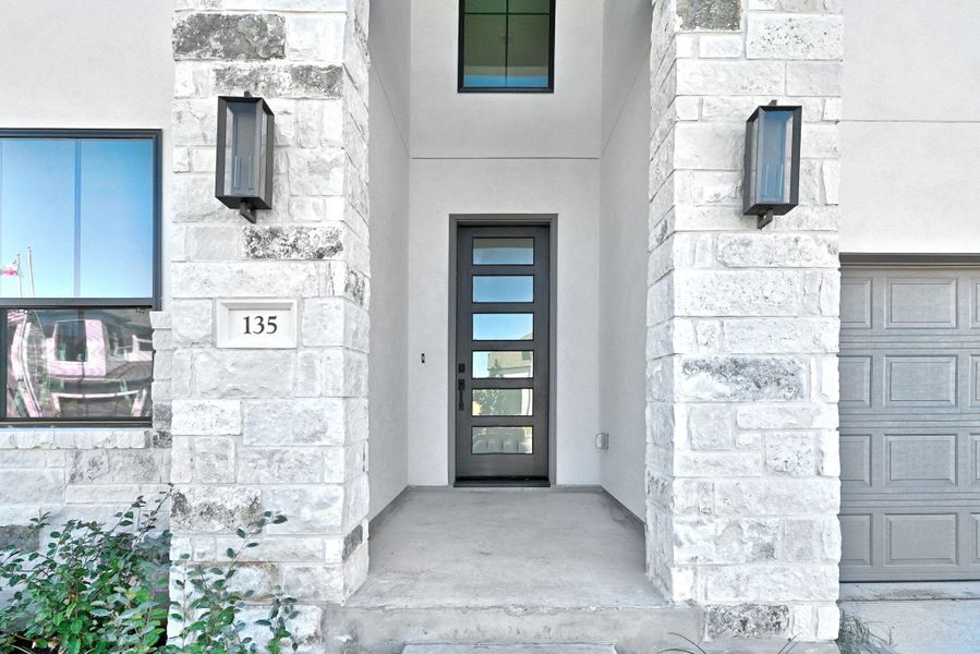 Exterior details and patio area of a home in The Colony, Bastrop (Image 3).