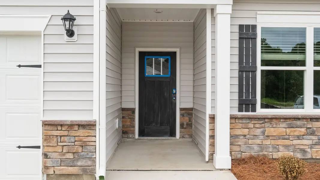 Exterior details and patio area of a home in Villa Grande, Winterville (Image 3).
