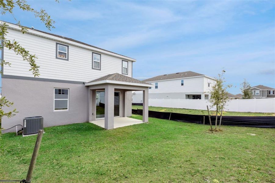 Exterior details and patio area of a home in Trinity Lakes, Groveland (Image 26).
