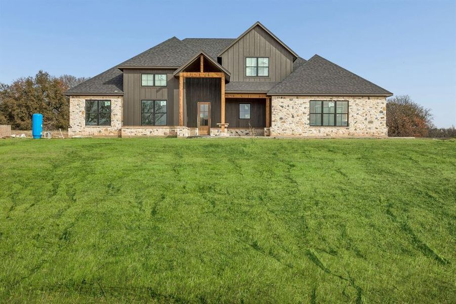 Front exterior of a new home in RangeWood, Weatherford, TX, highlighting curb appeal (Image 13). Front exterior of a new home in RangeWood, Weatherford, TX, highlighting curb appeal (Image 13).