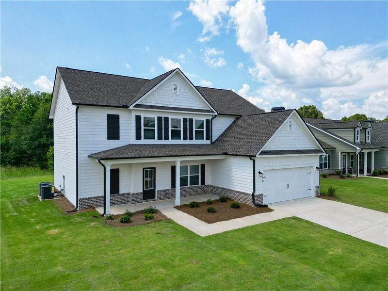 Front exterior of a new home in Harmony Farms, Eatonton, GA, highlighting curb appeal (Image 28).