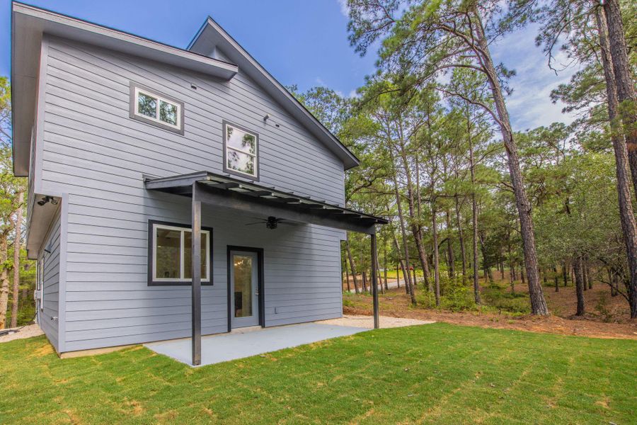 Exterior siding in a light gray finish with contrasting dark trim around windows and doors Exterior siding in a light gray finish with contrasting dark trim around windows and doors