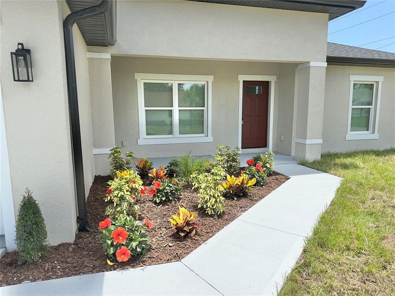 Front exterior of a new home in , Port Charlotte, FL, highlighting curb appeal (Image 22).