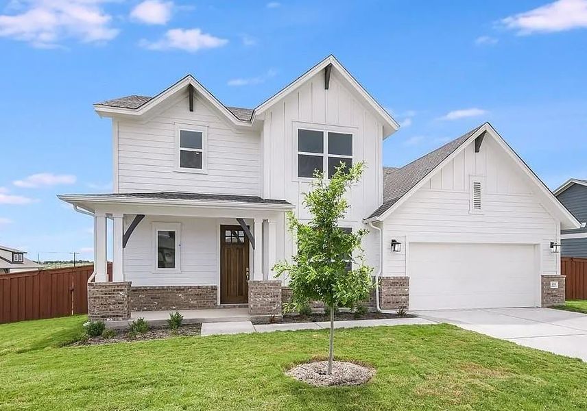 Representative exterior photo of a completed home built from the The Stagecoach by David Weekley Homes in Sunfield, Buda, TX (Image 4).