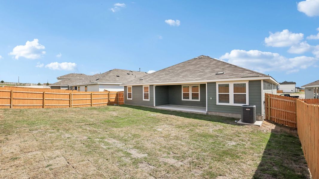Exterior details and patio area of a home in Prairie Lakes, Buda (Image 26).
