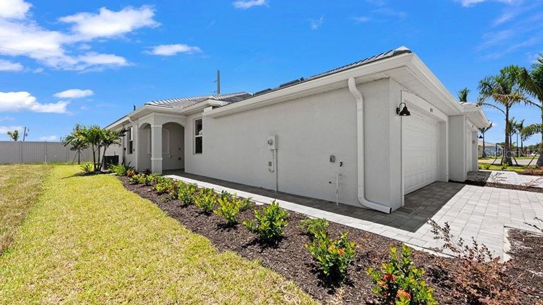 Exterior details and patio area of a home in Palm Lake at Coco Bay, Englewood (Image 4).