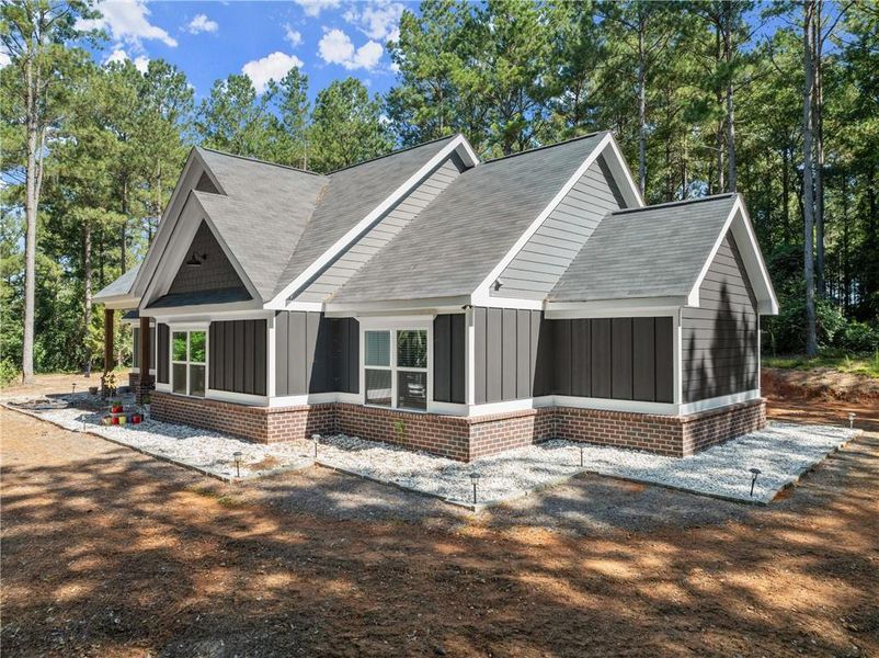 Front exterior of a new home in , Royston, GA, highlighting curb appeal (Image 1).