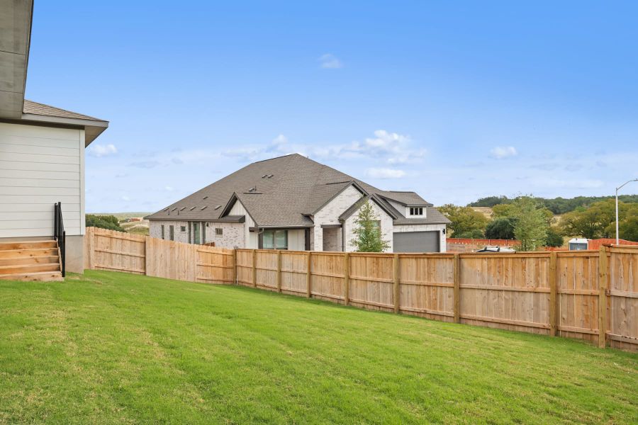 Exterior details and patio area of a home in Lariat, Liberty Hill (Image 26).