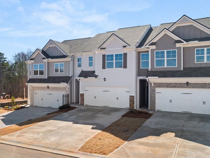 Front exterior of a new home in Waypoint, Flowery Branch, GA, highlighting curb appeal (Image 17).