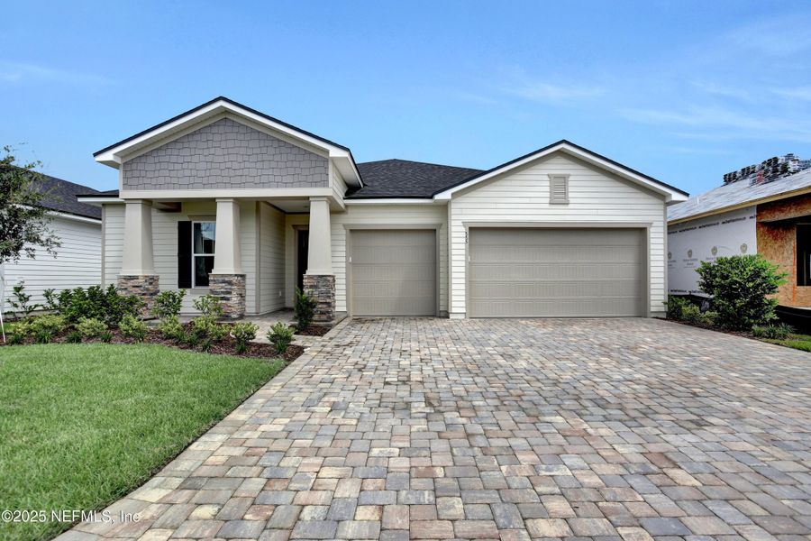 Front exterior of a new home in Reverie at Silverleaf, St. Augustine, FL, highlighting curb appeal (Image 2).