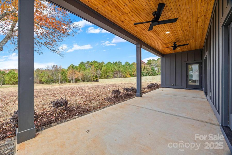 Covered Porch Overlooking Private Back Yard