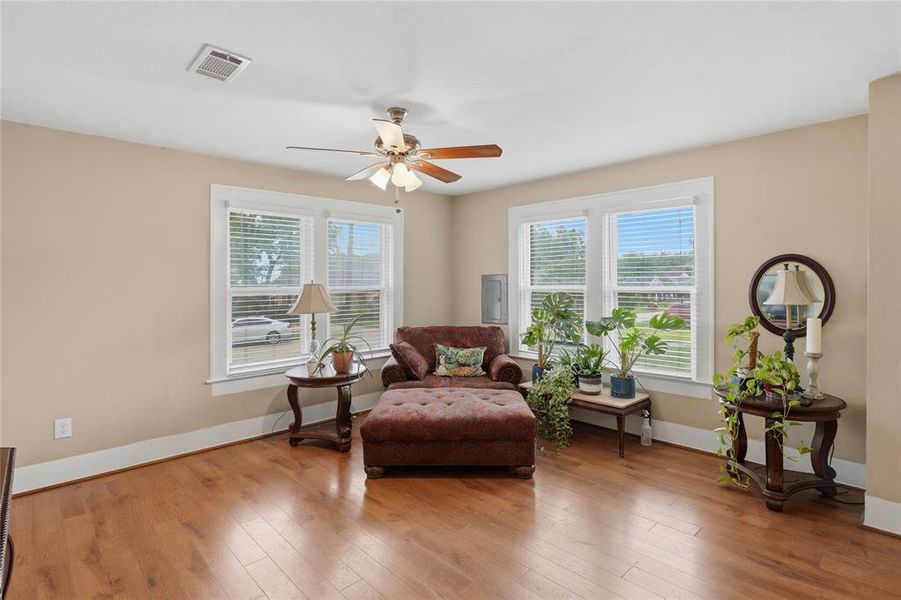 Living area featuring wood-finish flooring and neutral wall tones