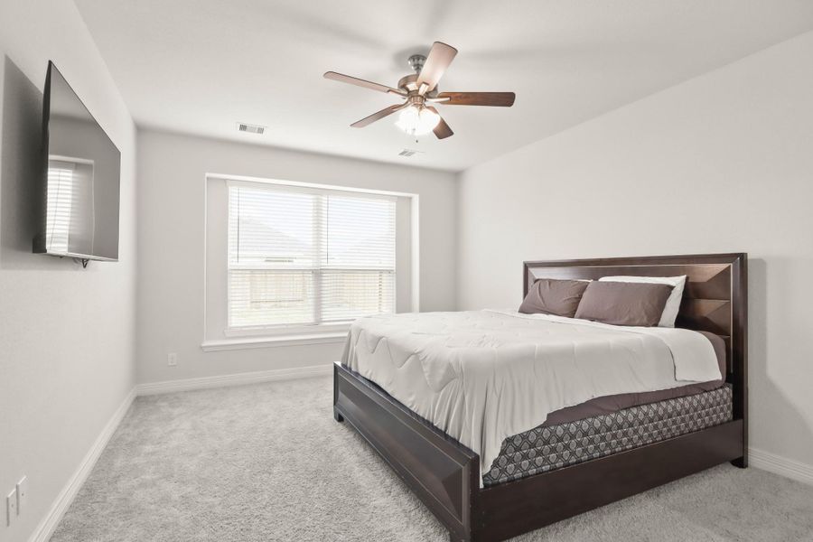 Escape to your generously sized owners retreat flooded with natural light