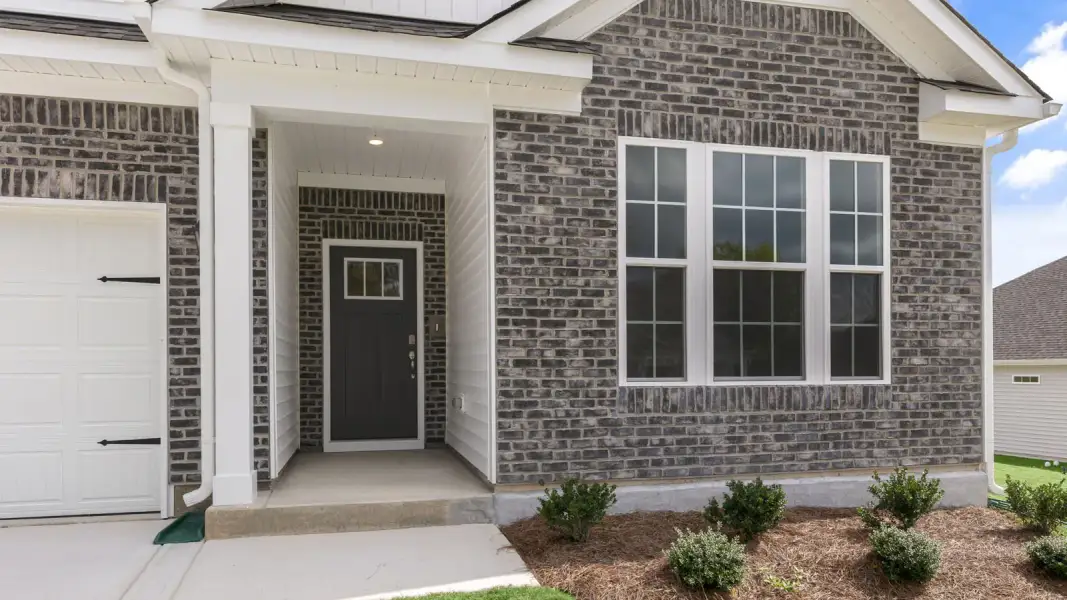Exterior details and patio area of a home in The Villas at Galvins Ridge, Sanford (Image 3).