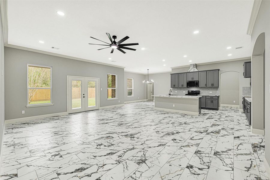 The spacious family room features beautiful tile floors with direct access to kitchen and dining area. The spacious family room features beautiful tile floors with direct access to kitchen and dining area.