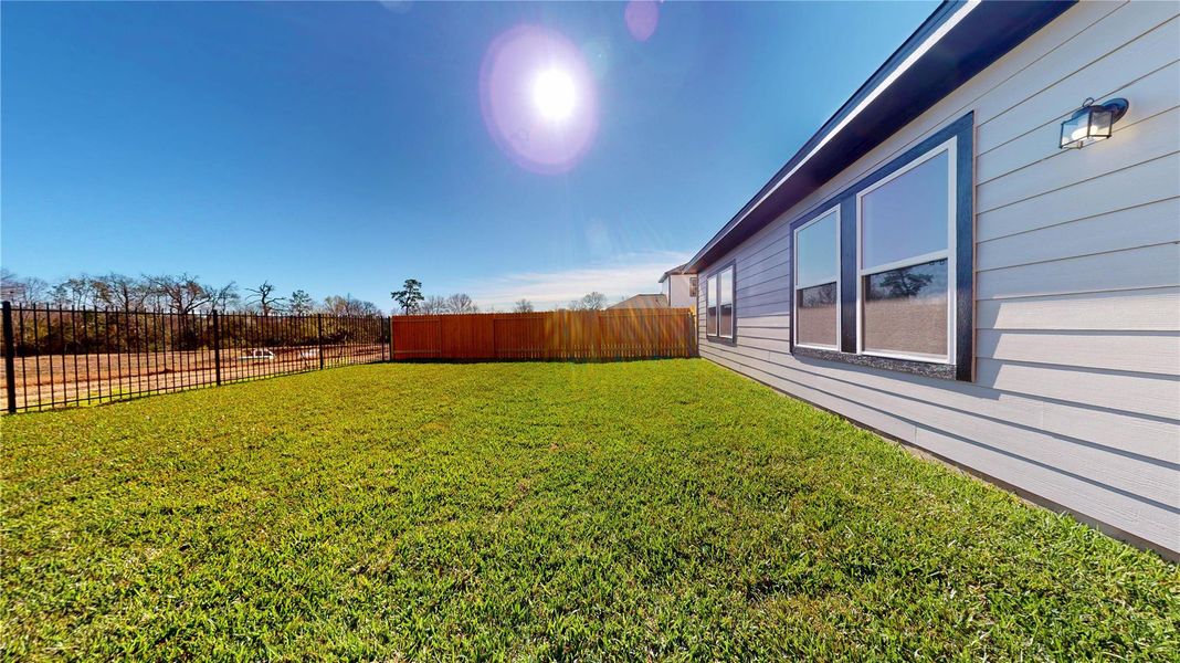 Exterior details and patio area of a home in Lexington Heights, Willis (Image 2). Exterior details and patio area of a home in Lexington Heights, Willis (Image 2).
