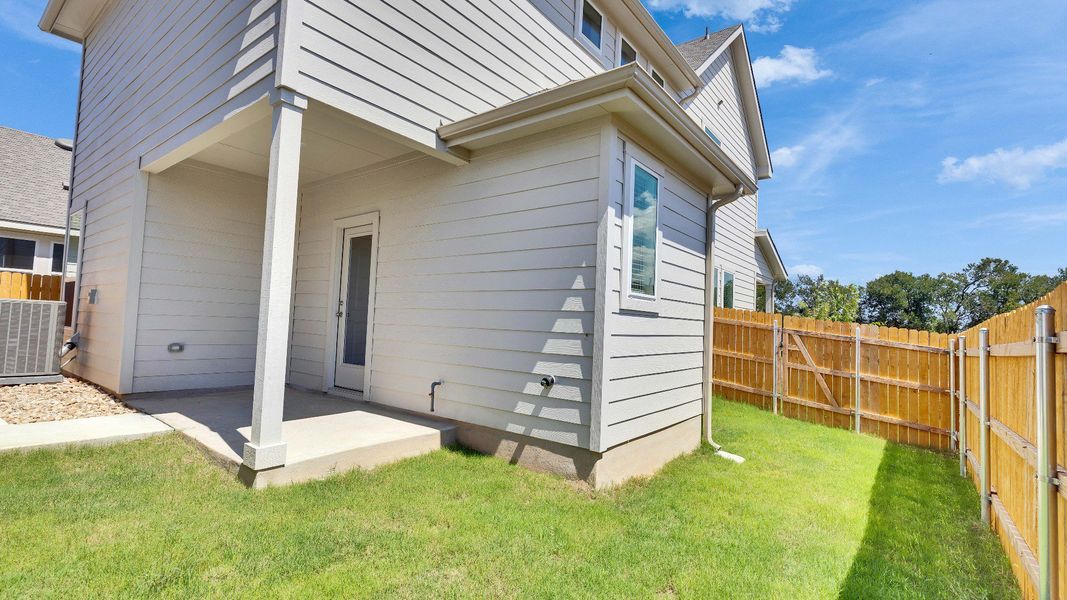 Exterior details and patio area of a home in Creeks Crossing, Elgin (Image 3).