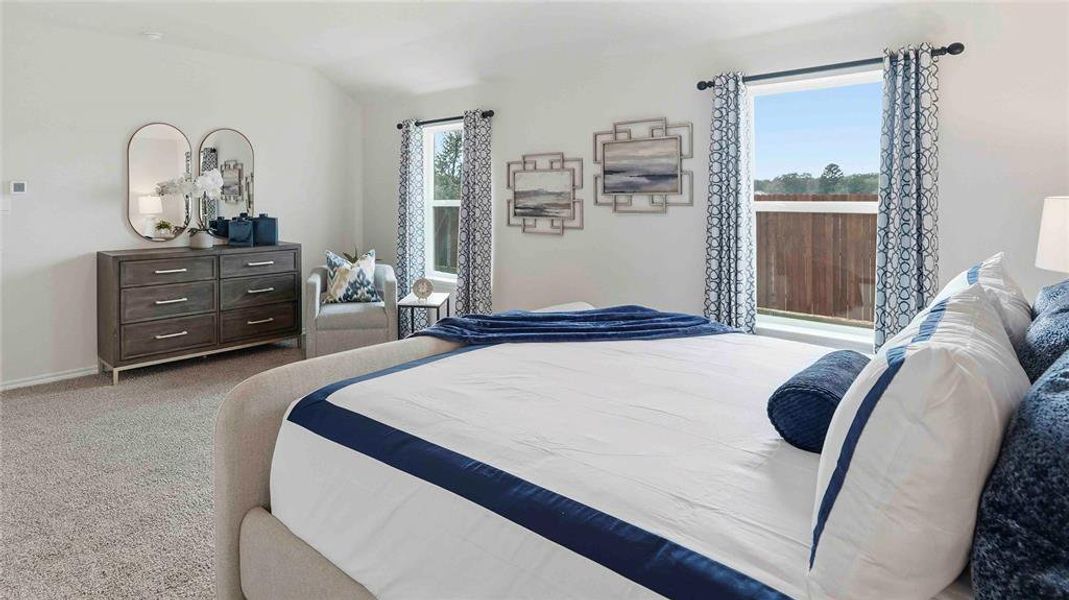 Bedroom featuring carpet floors and lofted ceiling