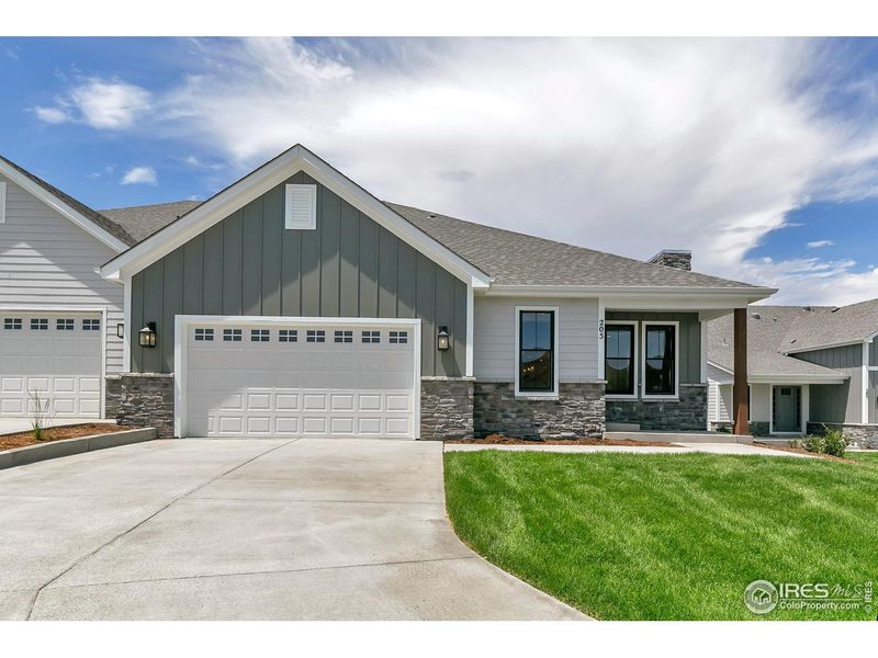 Front exterior of a new home in Cottages at Kelly Farm, Greeley, CO, highlighting curb appeal (Image 22).