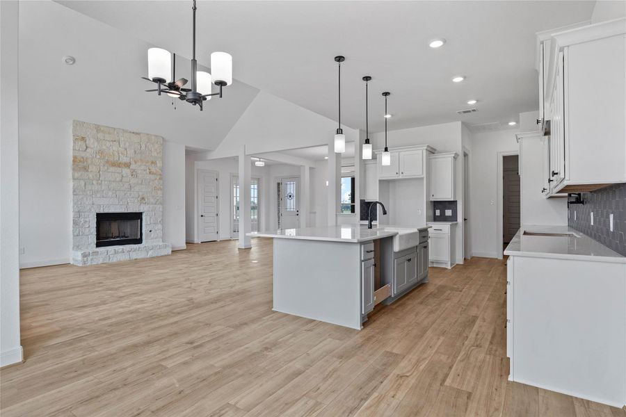Expanded view of kitchen and living area for entertaining.