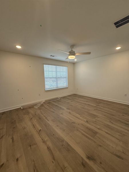 Empty room with recessed lighting, wood finished floors, and a ceiling fan