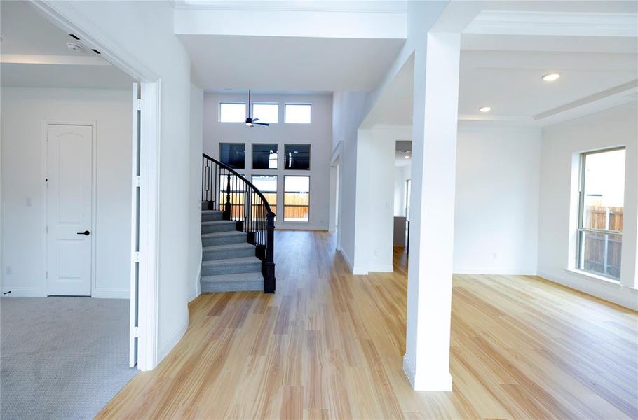 Foyer with stairs, light wood-type flooring, recessed lighting, and ceiling fan Foyer with stairs, light wood-type flooring, recessed lighting, and ceiling fan
