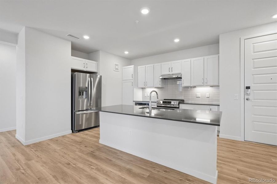 Furnished interior view inside a new home in Condo Collection at Grand Vue at Interlocken, Broomfield (Image 4).