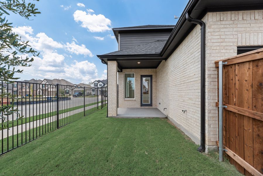 Exterior details and patio area of a home in Cottages of Celina, Celina (Image 24).