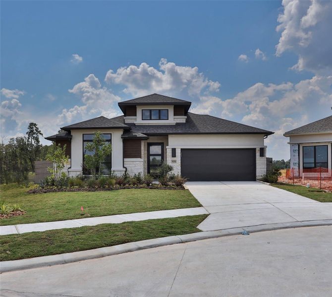 Front exterior of a new home in Artavia 55' - Valencia, Conroe, TX, highlighting curb appeal (Image 2). Front exterior of a new home in Artavia 55' - Valencia, Conroe, TX, highlighting curb appeal (Image 2).