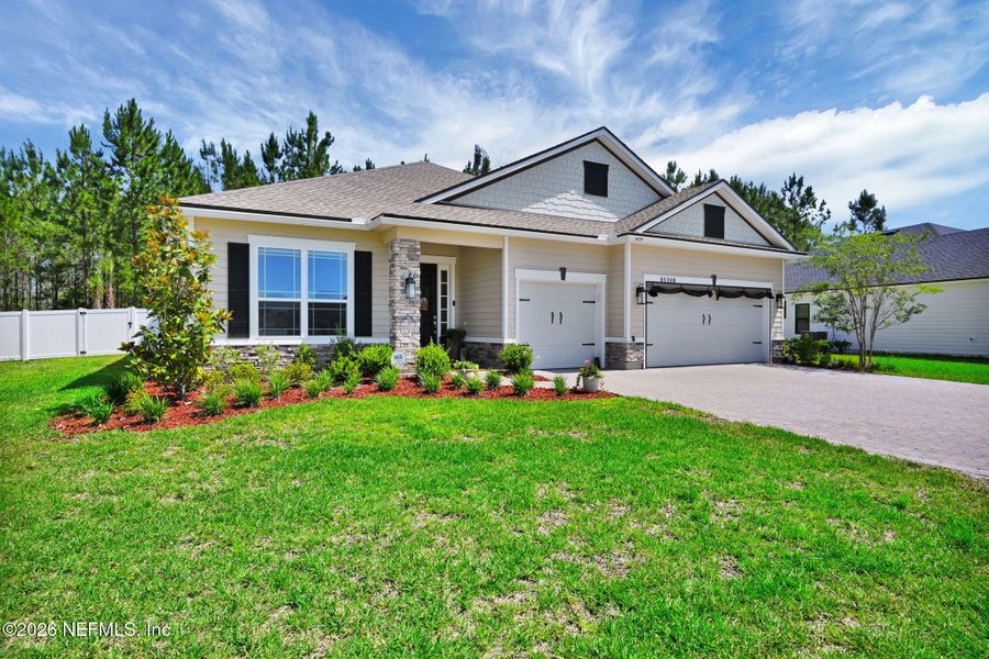 Front exterior of a new home in , Yulee, FL, highlighting curb appeal (Image 24).