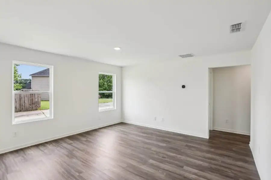 A room with a wood floor and a wood floor.