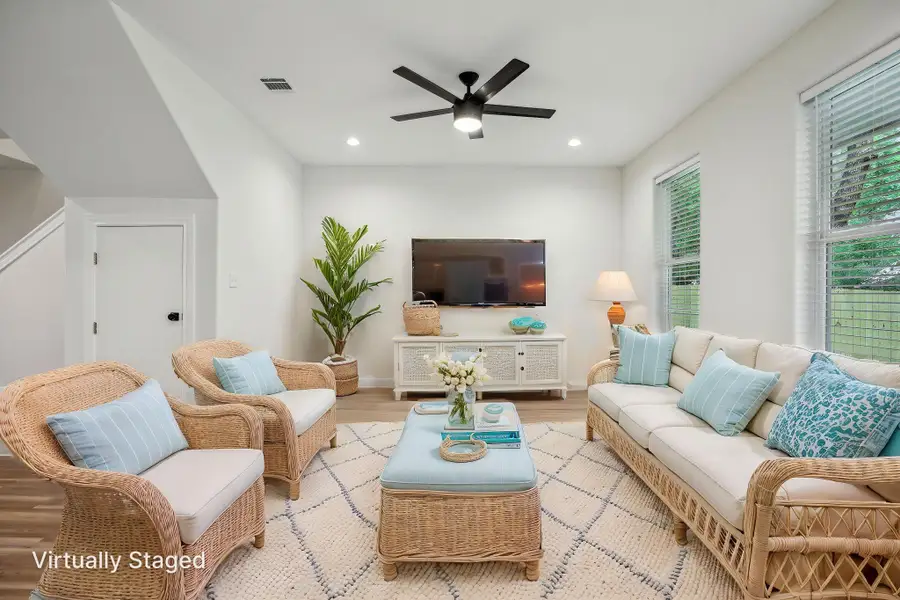 Virtually Staged Living area with recessed lighting, and ceiling fan