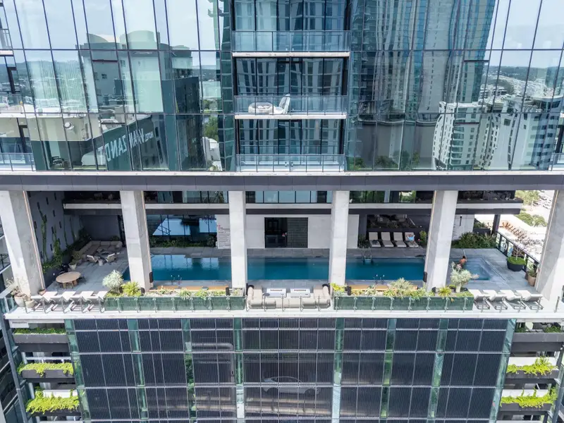 An aerial view captures the elegant pool and lounge areas that residents have full access to.