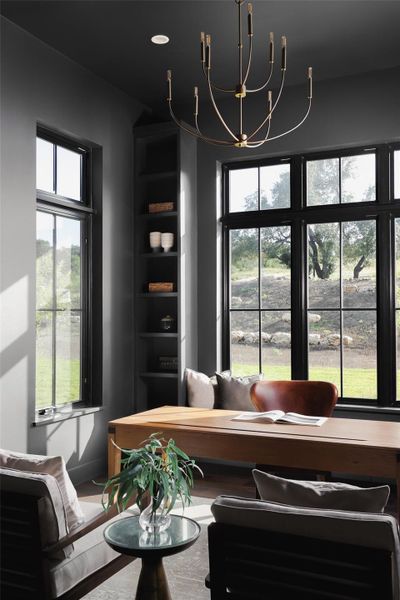 Inspiration from the Hill Country. Large windows in the study look out toward the mature trees and front landscaping, flooding the workspace with soft, natural light.