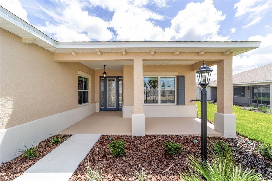 Exterior details and patio area of a home in On Top of the World Communities, Ocala (Image 3).