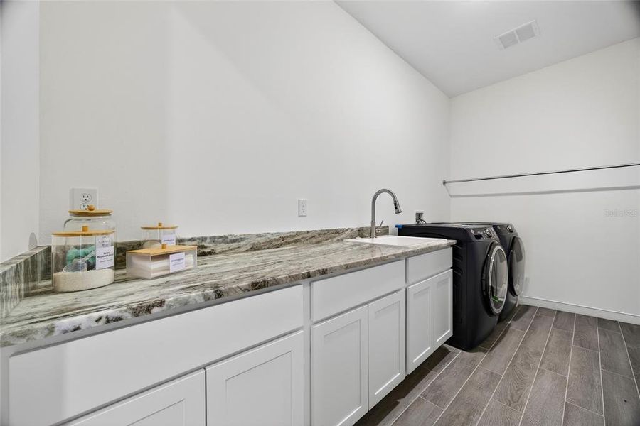 Furnished interior view inside a new home in Heritage Station, Punta Gorda (Image 37).