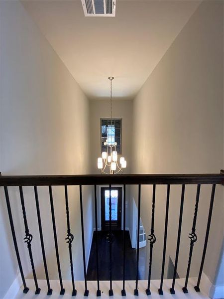 View of entry from upstairs with beautiful chandelier View of entry from upstairs with beautiful chandelier