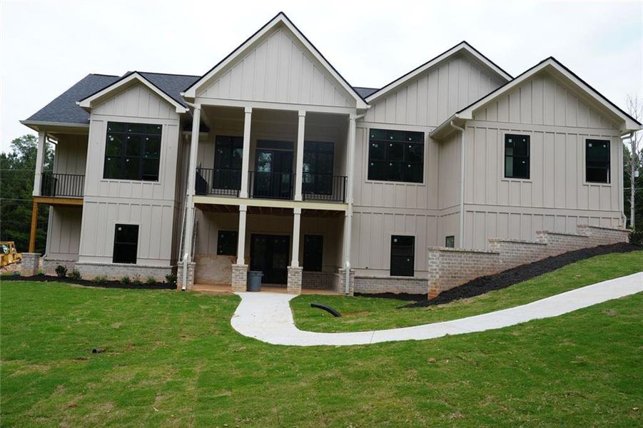Front exterior of a new home in , Conyers, GA, highlighting curb appeal (Image 1). Front exterior of a new home in , Conyers, GA, highlighting curb appeal (Image 1).