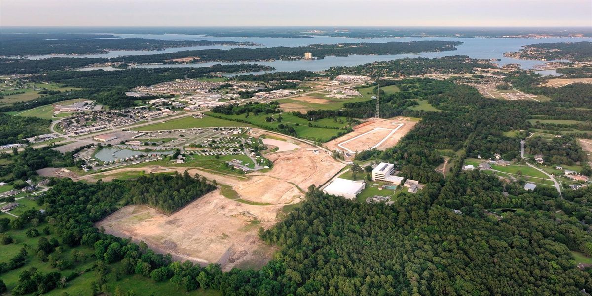 Residents of Montgomery Ridge will have access to playgrounds and picturesque walking trails. This gorgeous aerial view is a look at Lake Conroe.