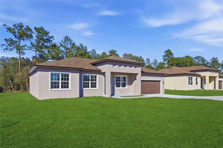 Front exterior of a new home in , Ocala, FL, highlighting curb appeal (Image 2). Front exterior of a new home in , Ocala, FL, highlighting curb appeal (Image 2).