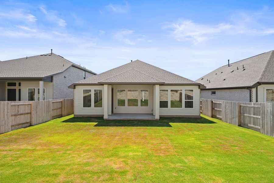 Front exterior of a new home in Park Collection at Lariat, Liberty Hill, TX, highlighting curb appeal (Image 25). Front exterior of a new home in Park Collection at Lariat, Liberty Hill, TX, highlighting curb appeal (Image 25).