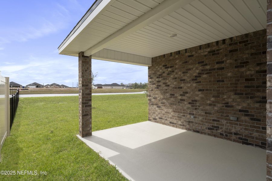Exterior details and patio area of a home in Shadow Crest at Rolling Hills, Green Cove Springs (Image 17). Exterior details and patio area of a home in Shadow Crest at Rolling Hills, Green Cove Springs (Image 17).