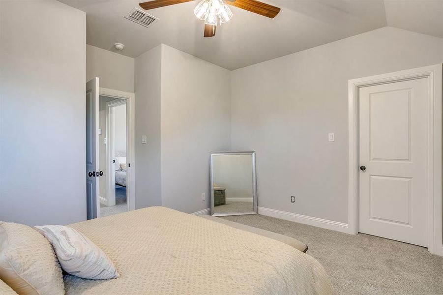 Bedroom featuring carpet and ceiling fan