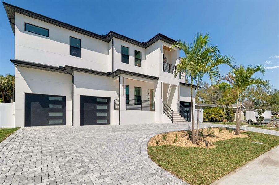 Front exterior of a new home in , Tampa, FL, highlighting curb appeal (Image 25).