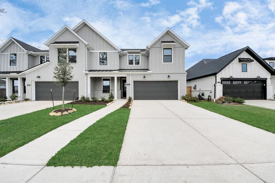 Front exterior of a new home in Sienna: Signature Series, Missouri City, TX, highlighting curb appeal (Image 27). Front exterior of a new home in Sienna: Signature Series, Missouri City, TX, highlighting curb appeal (Image 27).